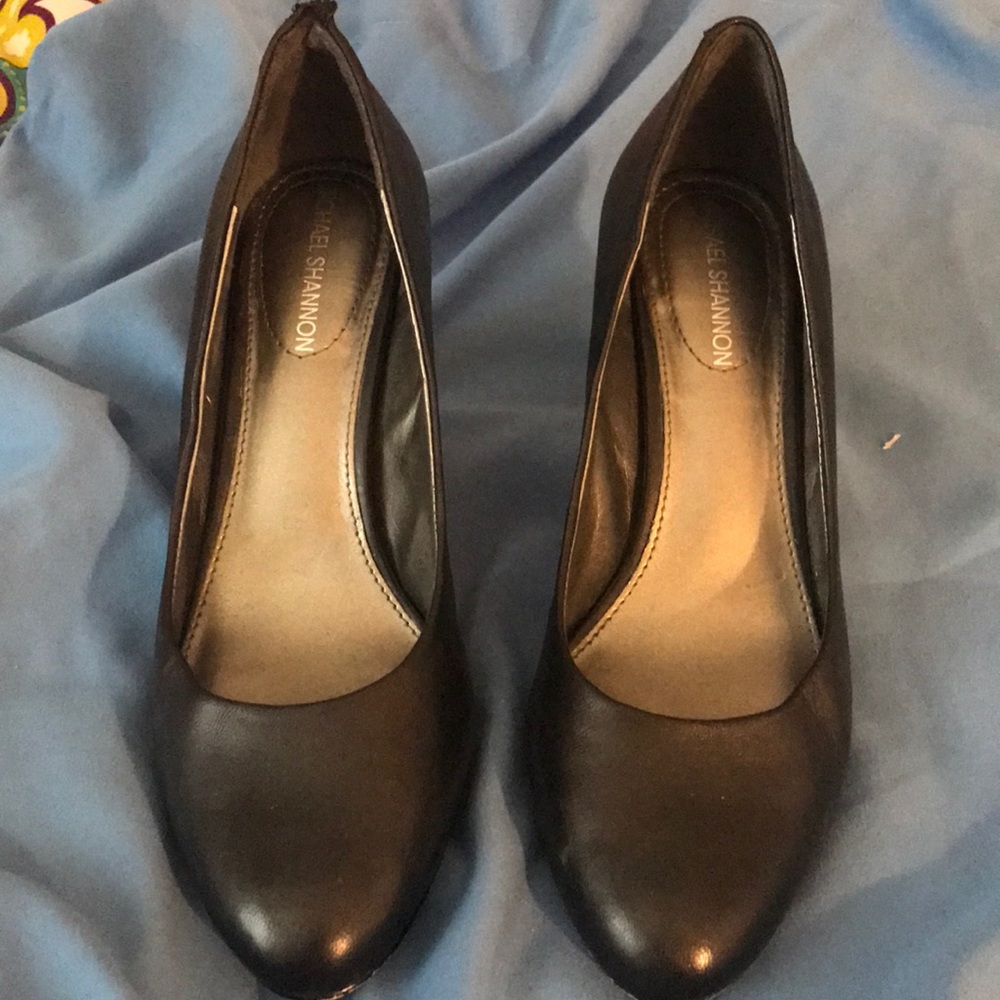 Black shoes with silver on the heels.